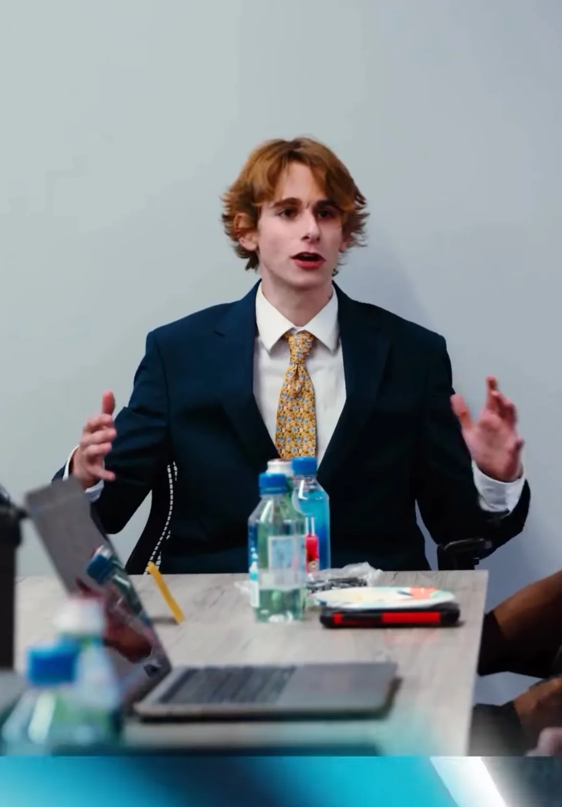 Jayden Clark of The New World Agency walking a client through an AI automation build in a strategy meeting